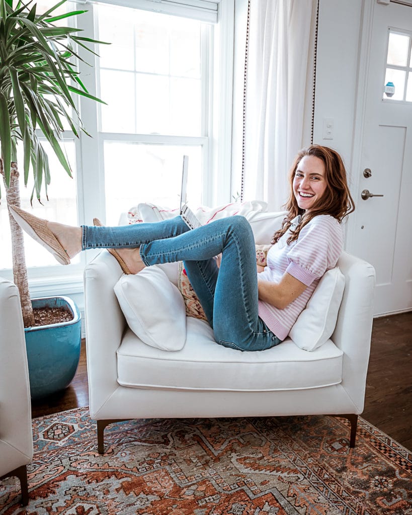 OUTFIT DETAILS: Shirt: Connelly Sweater | Shoes: Dolce Vita Raffia Mules | Bandana Scarf: Past season J.Crew / HOME DETAILS: Chair: "Caitlin by The Everygirl" c/o Interior Define. The color of our chairs is "Swan". | Rug: Loloi Loren Printed Rug from Bellacor. | Curtains: Stitched Edge Curtain Panels