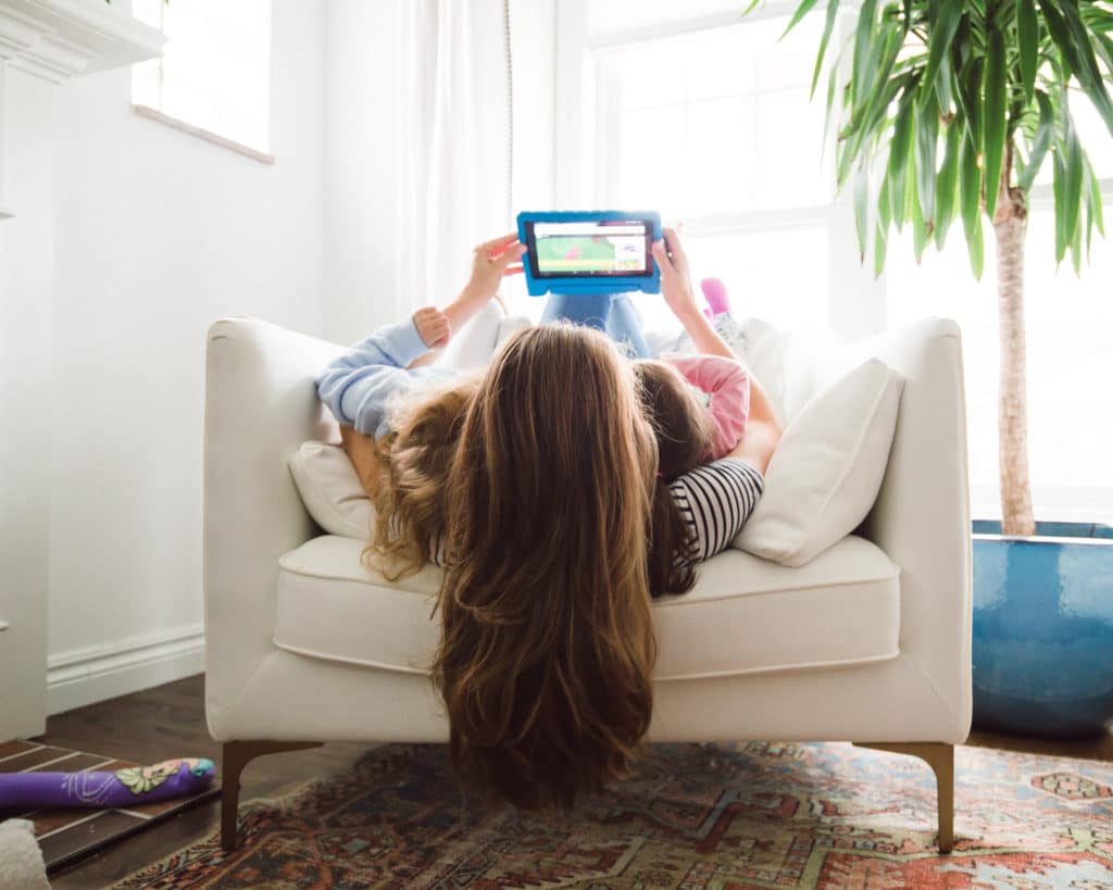 Family watching tablet