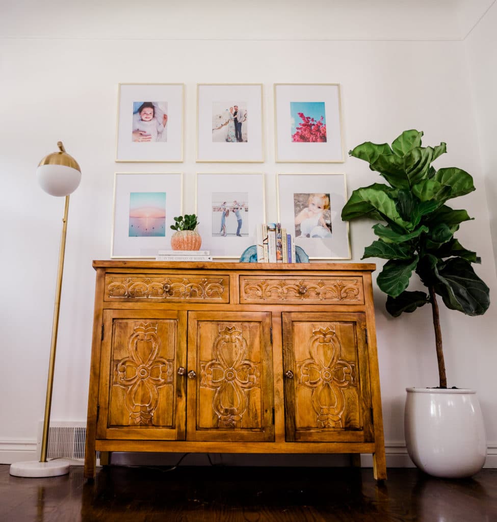 Gallery wall, boho style interior decor, gold accent lamp, Fiddle leaf fig plant