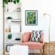 How to style bookshelves, pink chair, greenery on shelves